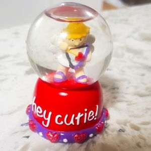 Cute small 2.5- 3 inch cupid snow globe with heart border